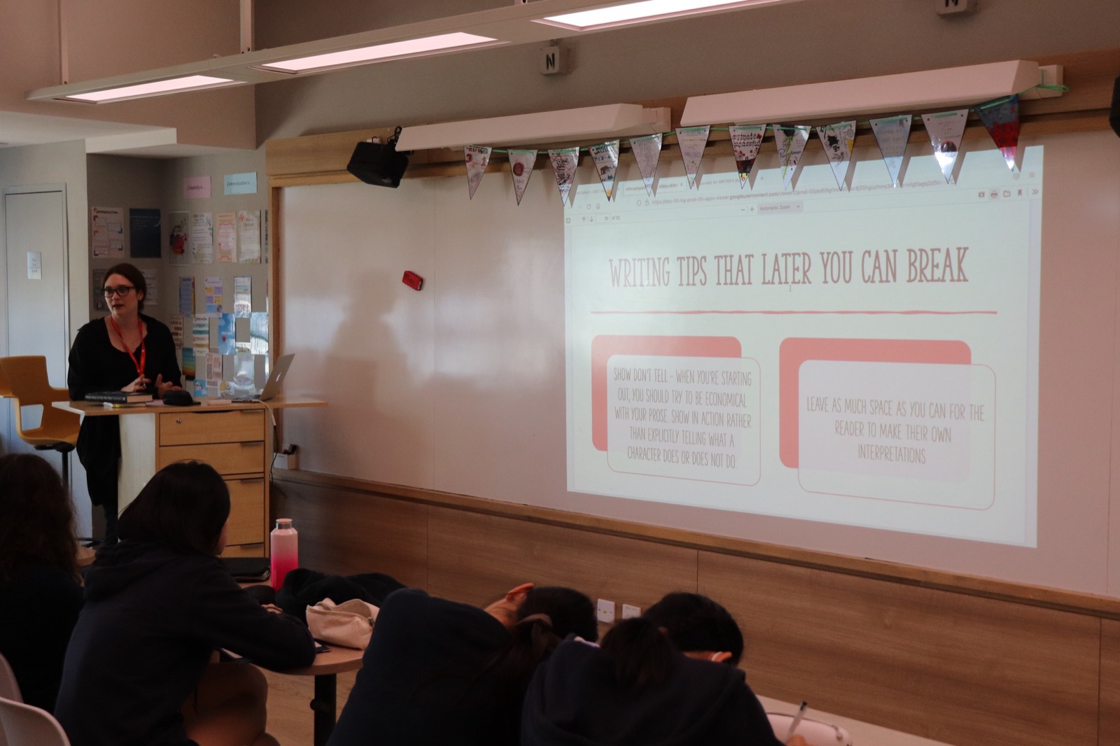 A Page Zero author leading a creative writing workshop in a school classroom